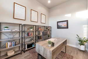 Home office featuring hardwood / wood-style floors