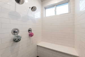 Bathroom with a tile shower