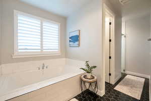 Bathroom featuring separate shower and tub