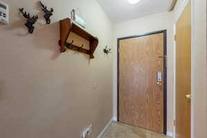 Entryway featuring light tile patterned floors