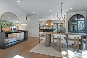 Dining room featuring a chandelier and light hardwood / wood-style floors