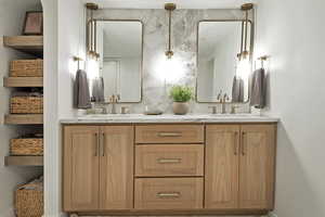 Bathroom featuring decorative backsplash and vanity