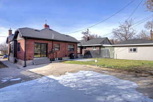 Back of house featuring a patio area and a yard