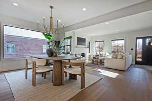 Dining space featuring a chandelier and hardwood / wood-style floors