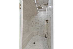 Bathroom featuring tiled shower