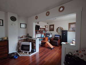 Interior space featuring heating unit and hardwood / wood-style floors