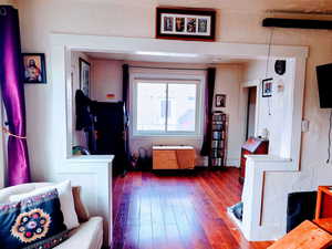 Living room featuring hardwood / wood-style flooring