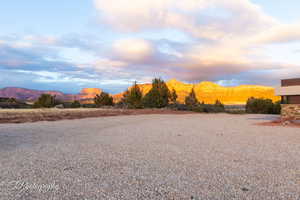 Yard at dusk with a mountain view