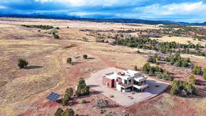 Birds eye view of property with a mountain view