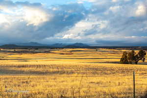 View of mountain feature with a rural view