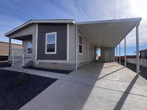 View of front of house featuring a carport