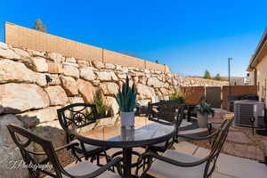 View of patio featuring central air condition unit