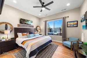 Bedroom featuring ceiling fan and light wood-type flooring