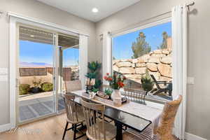 Dining room with a mountain view and light wood-type flooring