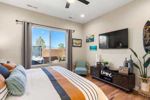 Bedroom with ceiling fan and light hardwood / wood-style floors