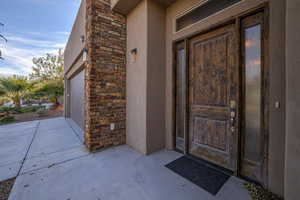 Property entrance featuring a garage