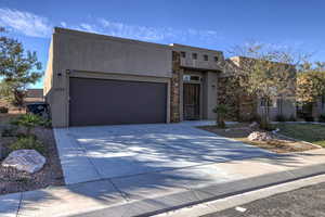 View of front facade featuring a garage