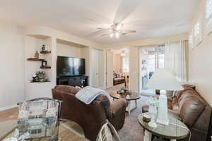 Living room featuring ceiling fan