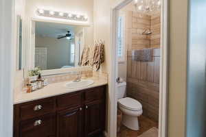 Bathroom featuring tile patterned floors, toilet, and vanity