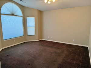 Empty room with carpet flooring and plenty of natural light