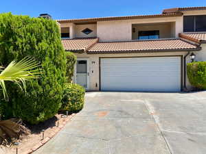 Mediterranean / spanish house with a garage