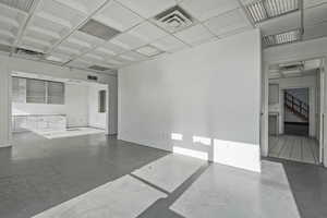 Unfurnished room with coffered ceiling