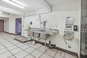 Interior space with sink and light tile patterned flooring