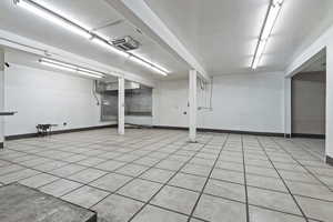 Basement with light tile patterned floors