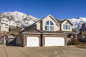 View of front of house featuring a garage and a mountain view