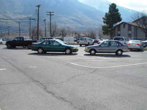 View of parking / parking lot with a mountain view