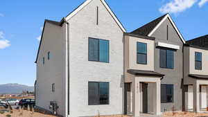 View of front of house with a mountain view