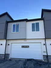 View of property exterior with a garage