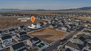 Birds eye view of property with a mountain view