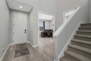 Entrance foyer featuring light wood-type flooring