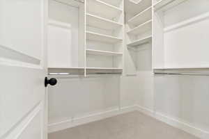 Primary Walk in closet with adjustable shelving