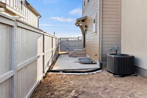 View of yard with a patio area and central AC unit