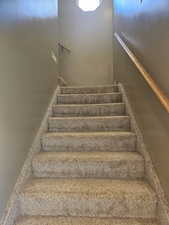 View of the stairway going to the primary bedroom