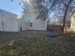 Back of house featuring a lawn