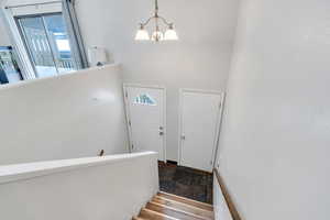 Foyer entrance with a chandelier