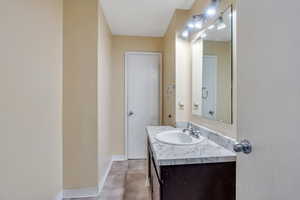 Bathroom featuring vanity and tile patterned flooring