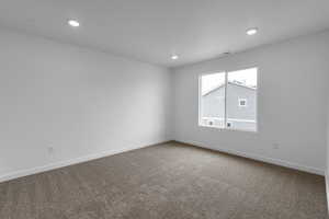 Unfurnished room featuring carpet