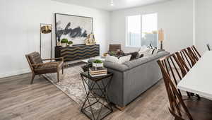 Living room with hardwood / wood-style floors