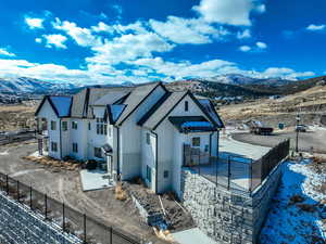 View of snow covered exterior with a mountain view