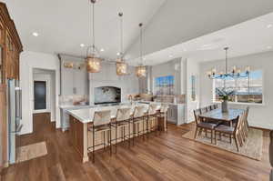 Kitchen with decorative backsplash, decorative light fixtures, and plenty of natural light