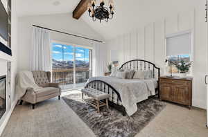 Bedroom with access to outside, a chandelier, high vaulted ceiling, light colored carpet, and beam ceiling