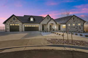 French provincial home featuring a garage