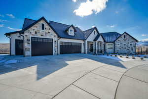 View of front facade featuring a garage