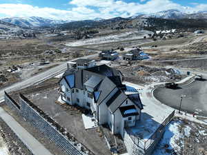 Snowy aerial view featuring a mountain view