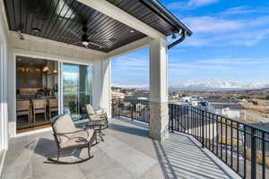 Balcony with ceiling fan and a mountain view