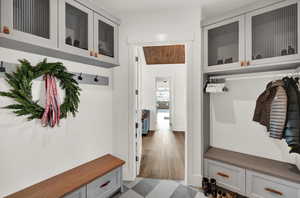 Mudroom featuring wood-type flooring